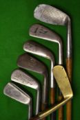 7x assorted clubs to include a Tom Stewart mashie and round backed mashie stamped Ben Sayers and