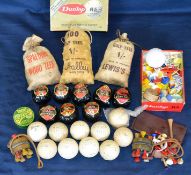 Interesting collection of wrapped golf balls^ bags of wooden golf tees^ golf ball markers and Dunlop