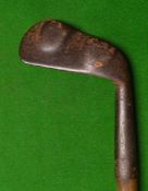 An unusual twin lumped back smf lofting iron - fitted with a period hide grip (bowed shaft)