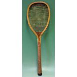 Rare Eureka wooden tennis racket with an excellent frame and a small^ round cork-handled grip. Red