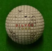 An unused mint Silvertown gutty golf ball with 95% original paint cover and still showing the red in