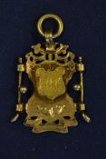 1896 silver gilt decorative golf medal - mounted with golf clubs^ balls and raised shield engraved