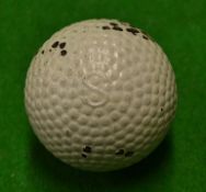 Bramble patent rubber core golf ball with S to the pole by the Silvertown golf company^ retaining