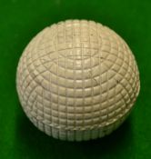 Original c1900 line mesh pattern rubber core golf ball - retaining 95% white paint finish but has