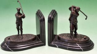 Pair of early bronze golfing bookends c1909 - each with a Victorian golfing figure on naturalistic