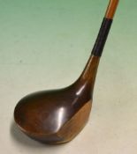 Fine and unusual oversize dark stained shallow face persimmon driver fitted with split cane shaft