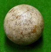 An early smooth gutty golf ball with good original paint cover