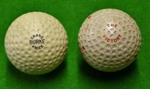 2x unused early rubber core balls to incl Burke "Grand Prize" 30 dimple pattern stamped J H Nash