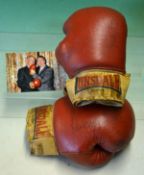 Rare pair of fight worn Henry Cooper boxing gloves signed by Cooper and Ali - comprising a red and