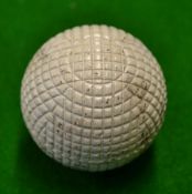 Original c1900 line mesh pattern rubber core golf ball - retaining 95% white paint finish but has
