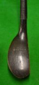 A fine J Morris c1890 transitional deep faced dark stained beech wood putter c/w full length hide