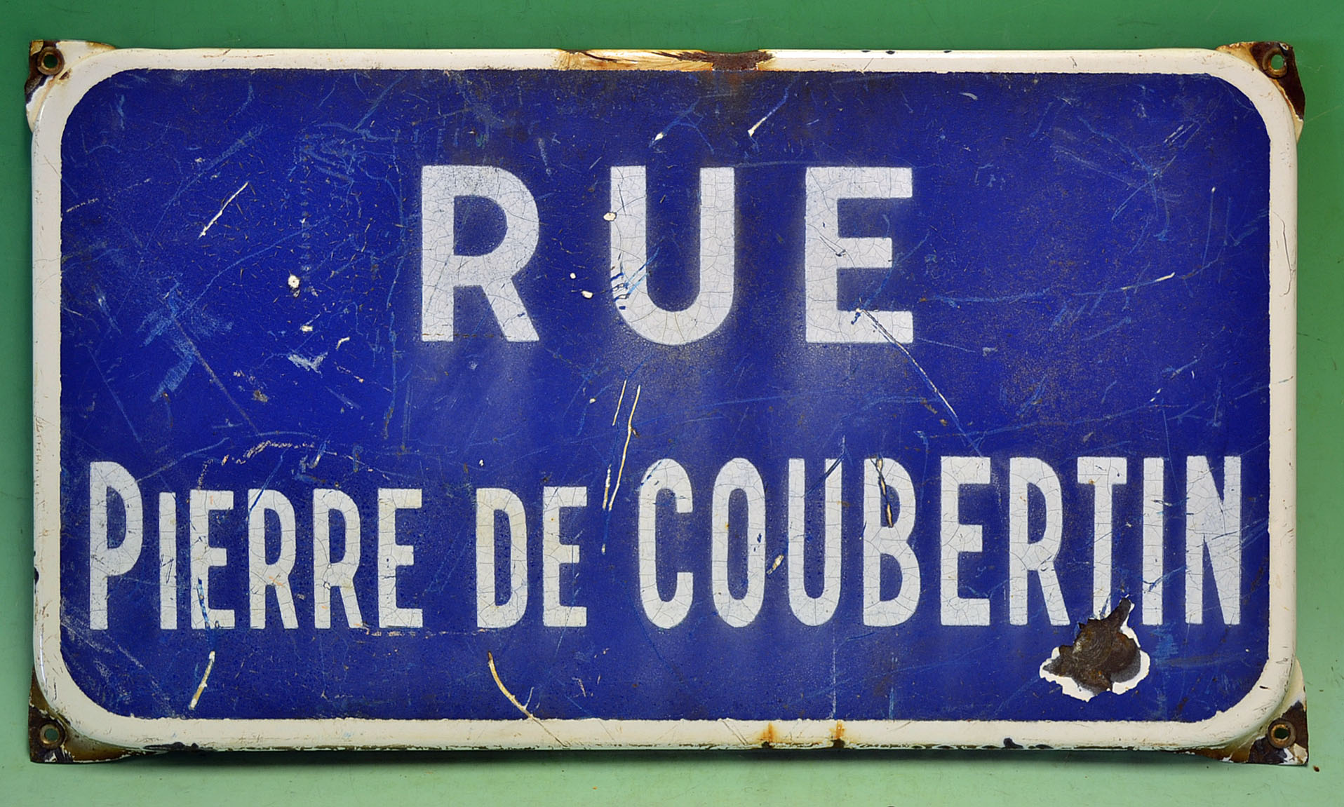 Olympics - French blue and white enamelled street sign "Rue Pierre de Coubertin". Note Pierre de