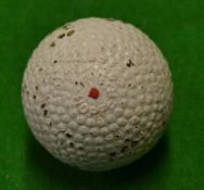 The Hopper bramble patent gutty golf ball retaining most of its original white paint^ with a central