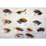 FLIES: (12) Collection of traditionally dressed gut eye salmon flies on black irons, various