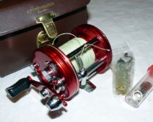 REEL: Abu Sweden Ambassadeur 6000 red multiplier reel, grooved end plates, 3 screw, black handle,