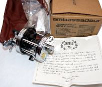 REEL: Abu Ambassadeur 5000C Anniversary reel in chrome finish, foot stamp 050005, 3 screw end plate,