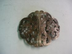 A Silver Belt Buckle In two halves. Pierced and scrolled decoration.