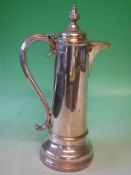 A Silver Plated Coffee Pot Of plain tapering form with foliate finial. Maker: Walker and Hall. 15"