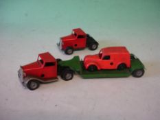 A Minic Clockwork Tinplate Truck and Trailer together with another truck (Losses) and a Minic Ford