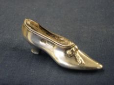A Silver pin Cushion In the form of a lady's shoe. Birmingham 1904-05. 2 ¾" long
