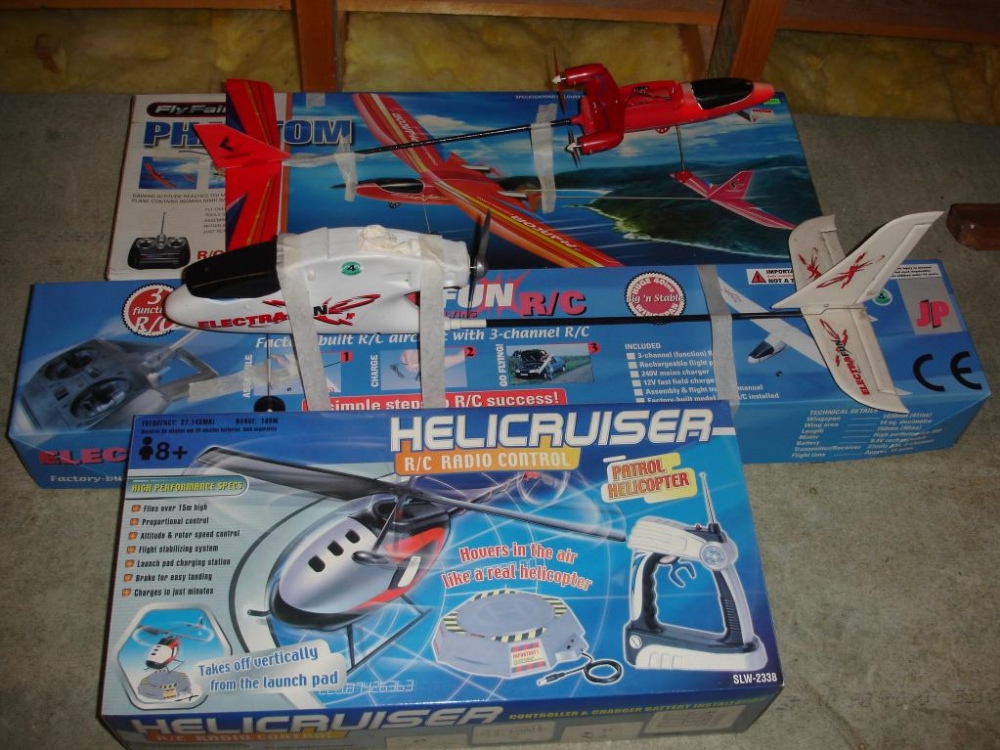 Two Radio Controlled Aeroplanes Together with a radio controlled helicopter