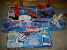 Two Radio Controlled Aeroplanes Together with a radio controlled helicopter