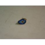 A Sapphire Brooch The gold set pear shaped stone with applied setting of pink stone and four split