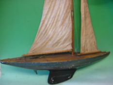 A Pond Yacht The wood hull with weighted keel and linked rudder. c1920s. 36" long