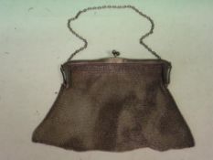 A Silver Lady's Evening Bag. Of fine chain mesh with ball form clasp. London 1922-1923. 6 ¼" wide