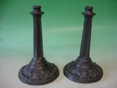 A Pair of Lead Candlesticks With fluted hexagonal stems and acanthus moulded bases. 18th century.