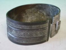 An Oriental Bronze Armlet With diaper or flower head decorated bands. 4 ¾" diam