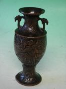 A Japanese Bronze Vase Meiji. With auspicious figures and exotic birds amid foliage. Rich brown