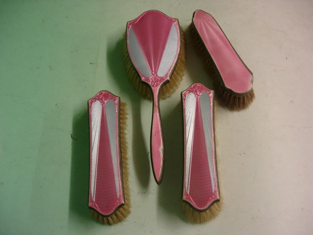 A Three Piece Brush Set Silver and guilloche enamel, together with a plated clothes brush