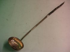 A George 111 Silver Punch Ladle with bright cut decoration and twisted whalebone handle. 15 ½" long.