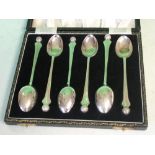 A Cased Set of Six Silver Teaspoons With golf ball terminals. Birmingham 1954