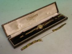 A Longines Lady's 9ct Wristwatch With link bracelet and leather case, together with a plated