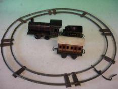 Gebruder Bing A tinplate 0 gauge clockwork train set comprising tank engine 2663, tender, coach