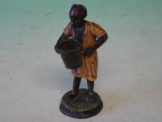 A Cold Painted Metal Figure A North African man with bucket. 3 ¾" high