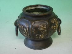 A Oriental Bronze Vase Of octagonal form with reserved gilt decoration of birds and prunus raised on