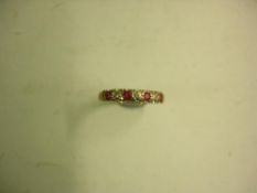 A Ruby and Diamond Seven Stone Ring Marked 375