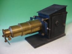 A Brass and Tinplate Magic Lantern with rackwork focusing, condenser and reflector, early electric