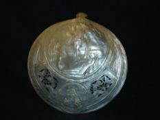 An Abalone Shell Carved in relief with a scene of the Ascension and pierced with foliage. 5" diam.