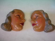 A Pair of Plaster Wall Plaques Modelled and painted as female heads in profile. c1930s. 8" high