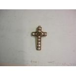 A Gold Crucifix Set with seed pearls and old cut diamonds. 30mm high. Probably 18th century