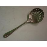 A White Metal Sifter Spoon With shell form bowl, the handle relief decorated with birds and foliage.