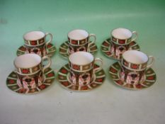 Royal Crown Derby Six coffee cans and saucers, decorated in Imari palette and gilded. Modern
