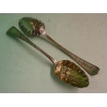 A Pair of Silver Berry Spoons The foliate engraved handles each with a vacant cartouche, the