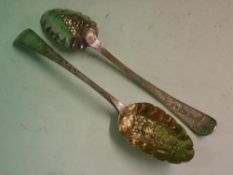 A Pair of Silver Berry Spoons The foliate engraved handles each with a vacant cartouche, the