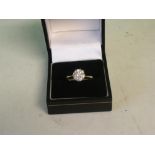A Diamond Solitaire Ring With a round brilliant cut diamond, in gold marked 18ct. Size N. The