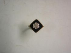 A Victorian 18ct Mourning Ring Cluster set with seven diamonds on a square jet table